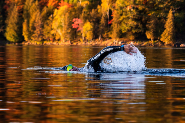 Open Water Swimmer swimming in Aquasphere wetsuit in autumn