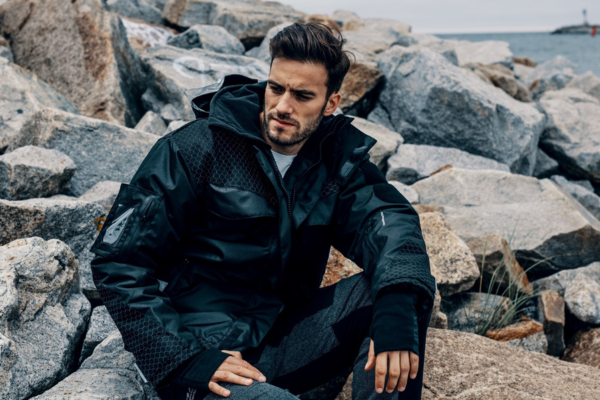 Man sitting on rocks in santi clothing