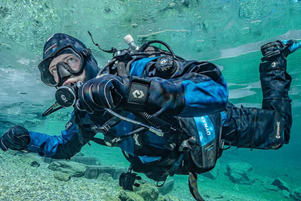 Diver underwater wearing DynamicNord Drysuit, Regulators, Fins and BCD