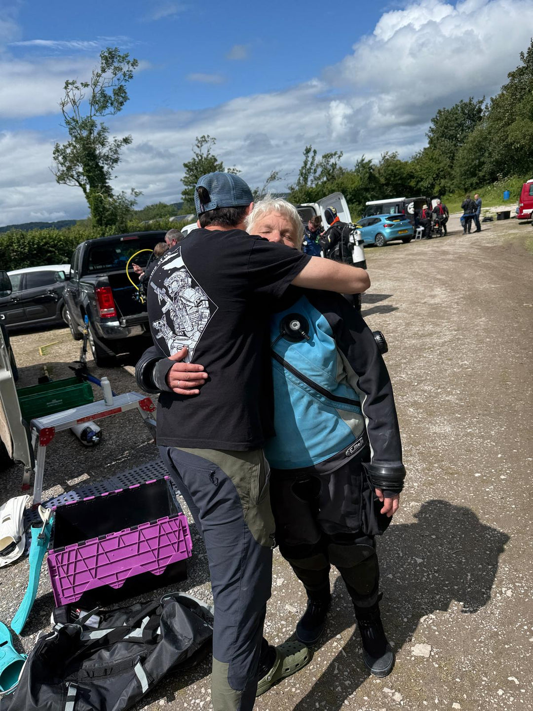 Tracey in Santi Drysuit being hugged by Jay saying Goodbye | Dive Rutland