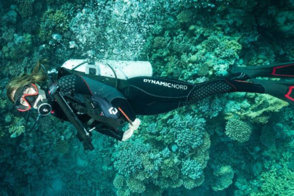 Female diver wearing DynamicNord full length wetsuit