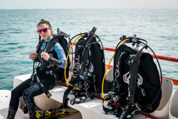Row of dive equipment setup on a dive boat
