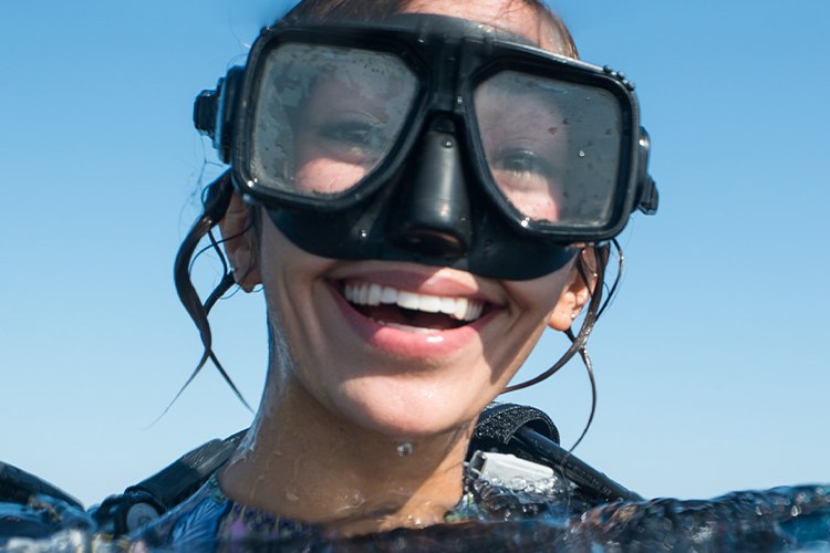 Diver at the surface wearing a twin-lens dive mask