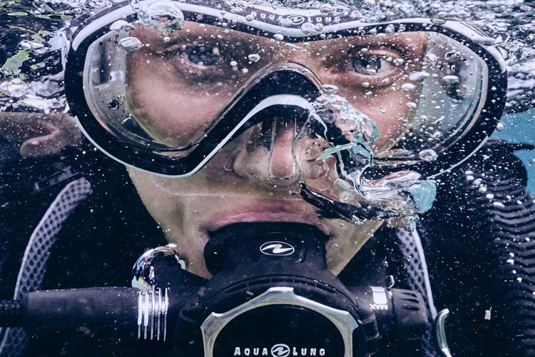 Diver underwater breathing from an Aqualung regulator