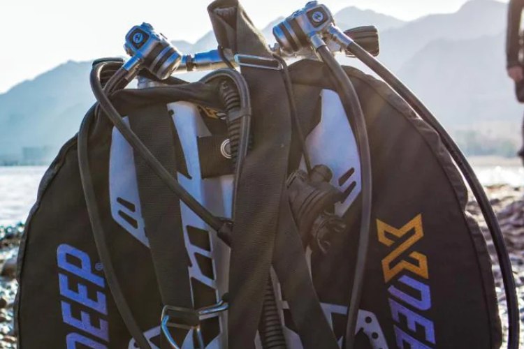 XDEEP wing and twinset rigged on a shoreline before a dive